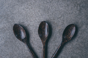 Rustic vintage set of cutlery, spoon, Black background. Top view