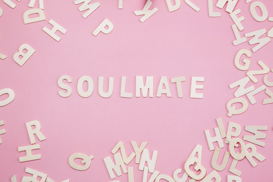 Sorting letters Soulmate on pink.