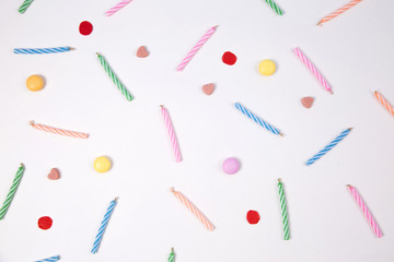 Candles for birthday party on pink background.