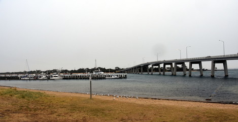Panorama at the concrete bridge to Phillip Island from San Remo in Victoria, Australia with white...