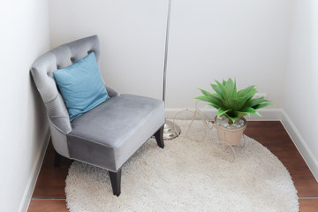 luxury grey tweed sofa with blue pillow in living corner at home