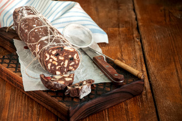 Сhocolate salami on a wooden board