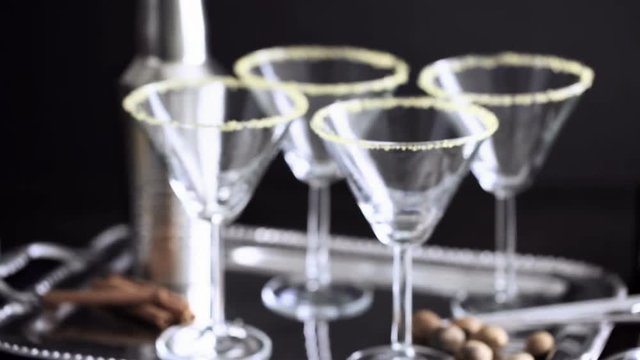 Martini glasses rimmed with brown sugar and set for egg nog cocktail at the minibar