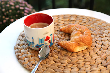 Coffee and croissant. French style breakfast in cafe