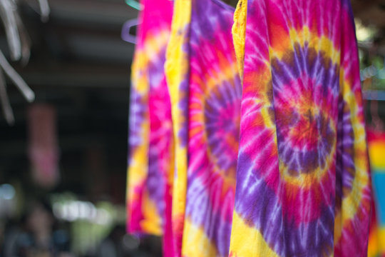 Multi-colored Batik fabric. Tie dye fabric. dry clothes in the sun