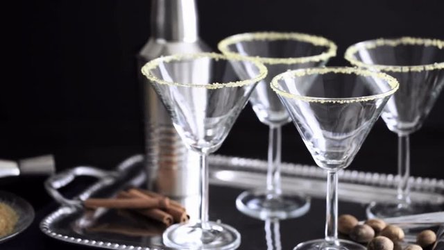 Martini glasses rimmed with brown sugar and set for egg nog cocktail at the minibar
