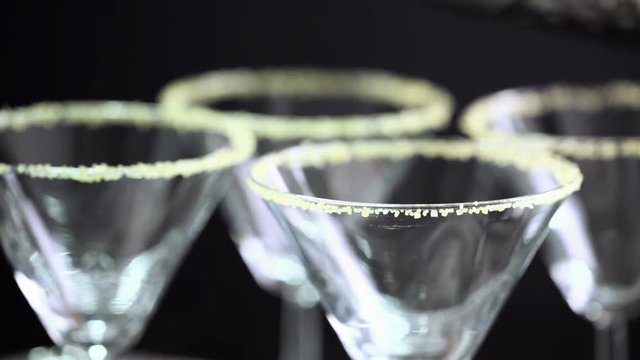 Martini glasses rimmed with brown sugar and set for egg nog cocktail at the minibar