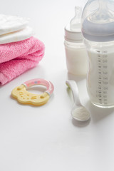 Obraz na płótnie Canvas preparation of mixture baby feeding on white background
