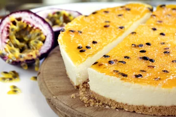 Tuinposter Passionfruit Cheesecake Side view on Old board © robynmac