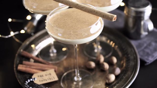 Egg nog cocktail in tall glasses on the tray at the minibar