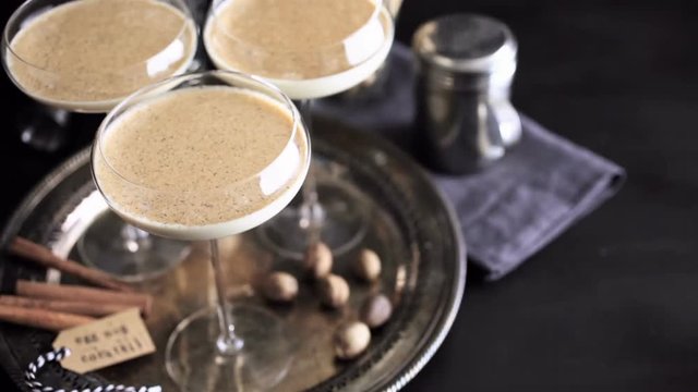 Egg nog cocktail in tall glasses on the tray at the minibar