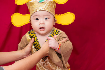 Asian baby in costume king of china cosplay