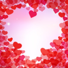 Valentines Day background with scattered blurred tender hearts