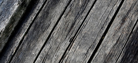 Wood pier, abstract texture of a natural gray. View of old weathered deck wooden board. Diagonal wood background texture.