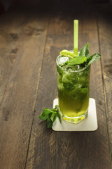 Mojito cocktail with mint leaves and lime