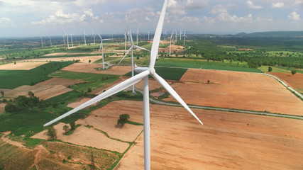 Aerial view of wind turbines in blue sky