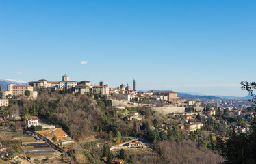 Fototapeta premium Bergamo - Old city (Citta Alta). One of the beautiful city in Italy. Lombardia. Landscape from the hills during a beautiful winter day with blue sky.