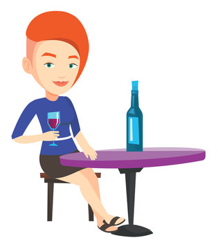 Woman drinking wine at restaurant.