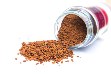 Instant coffee in bottle on white background