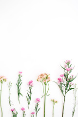 Obraz na płótnie Canvas Colorful wildflowers on white background. Flat lay, top view. Valentine's background
