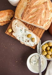 Homemade bread with cream cheese and olives