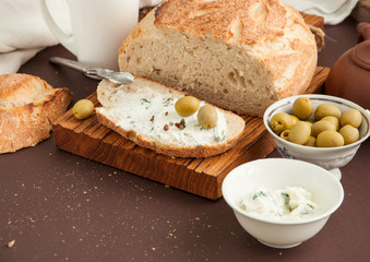 Homemade bread with cream cheese and olives