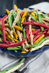 Best italian food - home-made multicolored pasta, uncooked