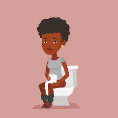 Woman suffering from diarrhea or constipation.