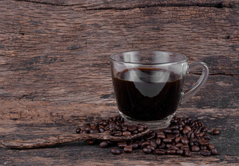 Black coffee isolated on the wooden floor