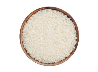 Uncooked Japanese white rice in brown wood bowl isolated on white background