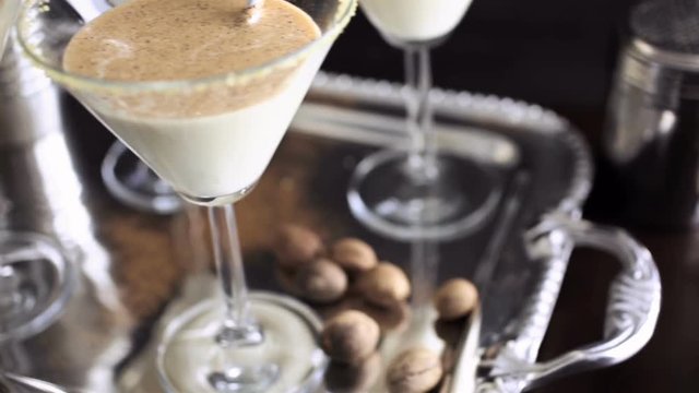 Egg nog cocktail in glasses rimmed with brown sugar at the minibar