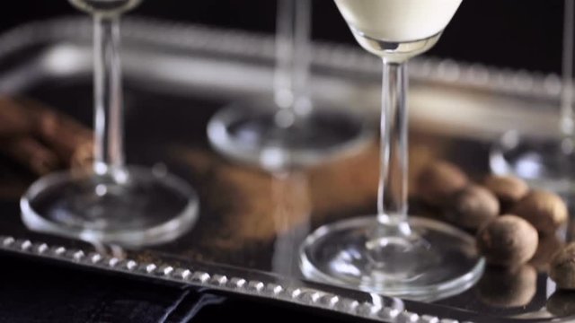 Egg nog cocktail in glasses rimmed with brown sugar at the minibar