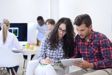 business couple working together on project at modern startup office