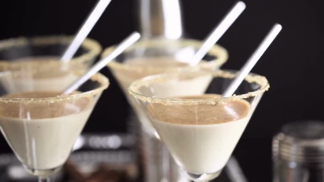 Egg nog cocktail in glasses rimmed with brown sugar at the minibar