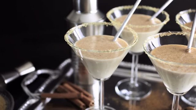 Egg nog cocktail in glasses rimmed with brown sugar at the minibar