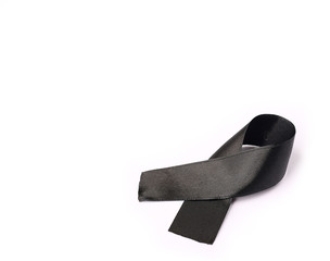 black ribbon bow fabric texture, Ribbon awareness symbol of remembrance campaign or mourning over person's death, Pray for world peace concept