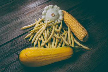 vegetables  green beans, corn, zucchini, squash on old wooden background in rustic style - 133474755
