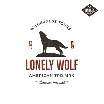 Old style wilderness label with wolf and typography elements. Vintage letterpress effect print. Prints of howling wolf. Unique design for t-shirts, mugs. Hand drawn wolf insignia, rustic design Vector