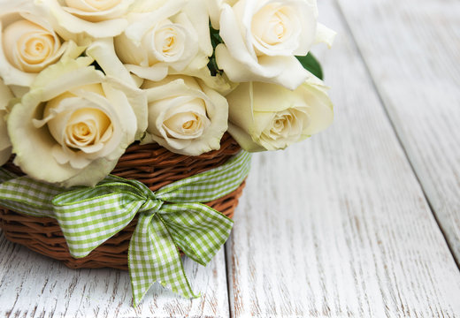 White roses in a basket