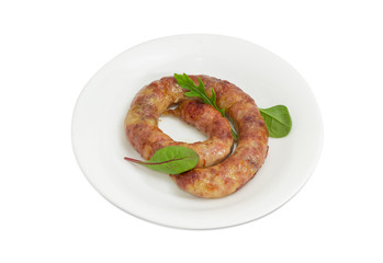 Fresh roast pork sausage on a white dish