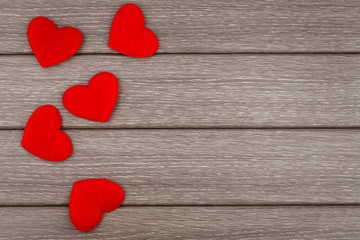 Red hearts on wooden background, vector illustration