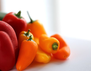 sweet pepper with water drops on blurred  background