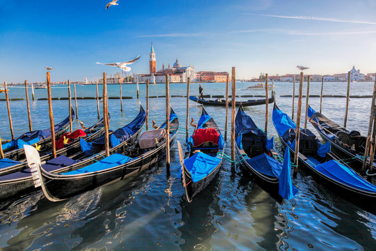 Gondolas in Venice against San Giorgio Maggiore church in Italy