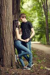 In love Girl and boy in a forest walk