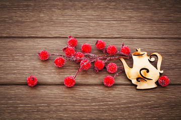 Christmas decoration, red berries and wooden toys, retro style