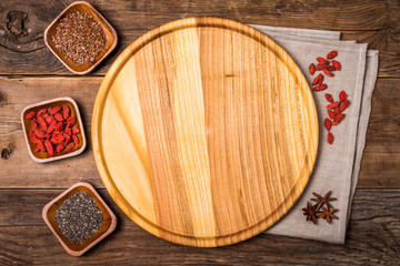 Seeds and goji in a wooden bowls