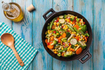 Mix of vegetables fried in a wok.