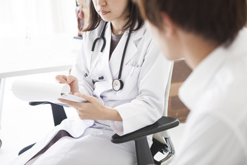 Female doctor is interrogating male