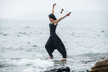 Obraz premium fire show on the shore of the sea