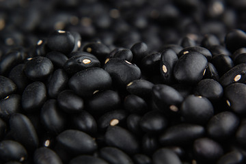 Black kidney beans macro background. Healthy protein food.